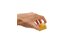 The spreader insert is held folded in one hand and shines in sunny yellow with the SONNENTOR logo on it.
